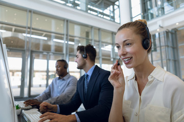Call centre agents working in open plan office