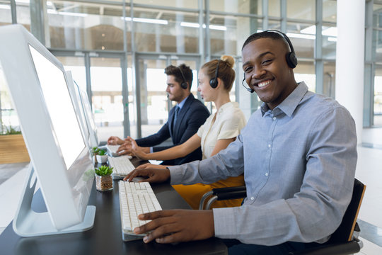 Portrait of young man working in a call centre