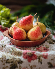 pears in a clay bowl