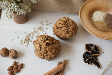 Whole wheat flour muffins. Sugar-free dessert, Healthy diet. Beautiful composition of flowers, ingredients and dessert