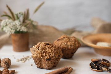 Whole wheat flour muffins. Sugar-free dessert, Healthy diet. Beautiful composition of flowers, ingredients and dessert