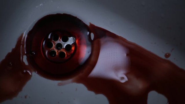 Blood getting washed down sink hole