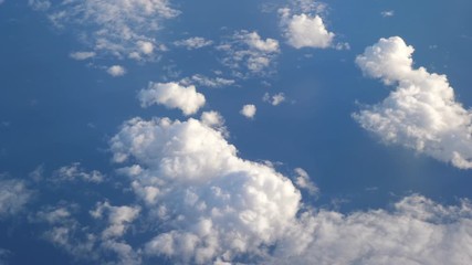 Aerial shot above the clouds in 4K slow motion 60fps