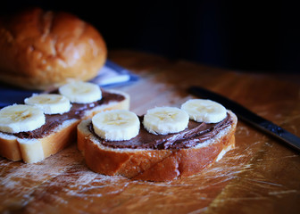 White bread with chocolate paste and bananas