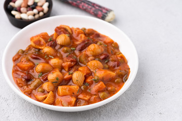 vegetable grains peas soup in tomato sauce