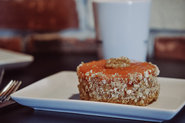 yellow cake with nuts on plate