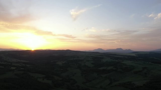 Purple sky and sun before sunset over Deli Jovan Stol and Veliki Krs mountains 4K drone video