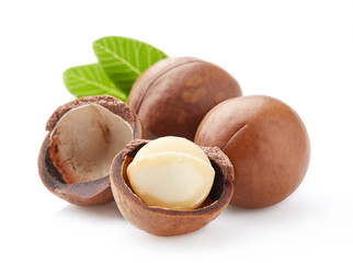 Macadamia nuts with leaves in closeup