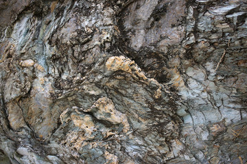 Background texture of rough cliff rock wall