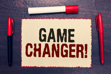 Writing note showing Game Changer. Business photo showcasing Sports Data Scorekeeper Gamestreams Live Scores Team Admins Open notebook page markers communicating ideas with wooden background