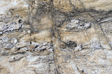 Background texture of rough cliff rock wall