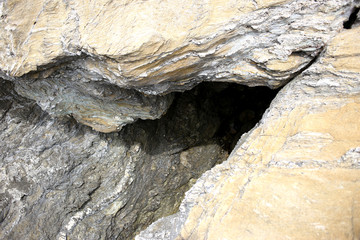 Background texture of rough cliff rock wall