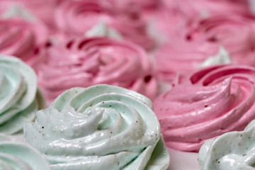Freshly made marshmallows lie on the surface of the table. It is stabilizing