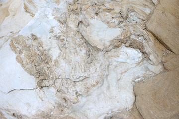 Background texture of rough cliff rock wall