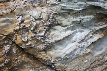 Background texture of rough cliff rock wall