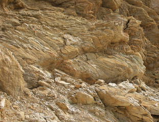 Background texture of rough cliff rock wall