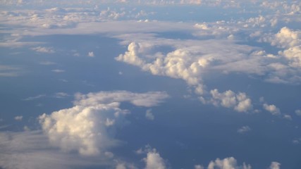 Aerial shot above the clouds in 4K slow motion 60fps