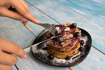 Pancake with currant jam and currant berries