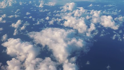 Aerial shot above the clouds in 4K slow motion 60fps