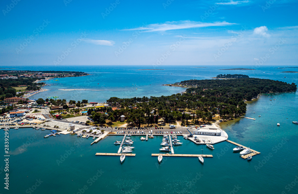 Poster Aerial view from Medulin marina bay under beautiful blue sky with nice white clouds aerial view, Croatia - Posters