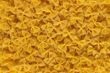 Farfalle shape of italian pasta as background banner