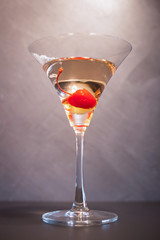 Cocktail alcohol with red cherry.