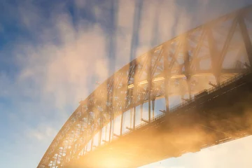 Papier Peint photo Sydney Harbour Bridge Close-up view of Sydney Harbour Bridge with sunlight rays.