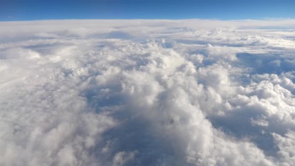 Aerial shot above the clouds in 4K slow motion 60fps