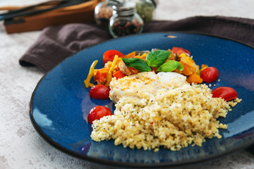Baked salmon, vegetables and sorrel sauce accompanied oatmeal, lentil and cooked rice