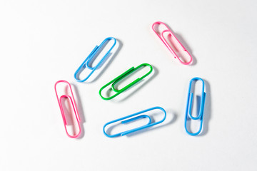 Colorful paper clips isolated on white background