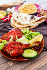 Traditional Indian food chicken tandoori and Tikka with garlic naan