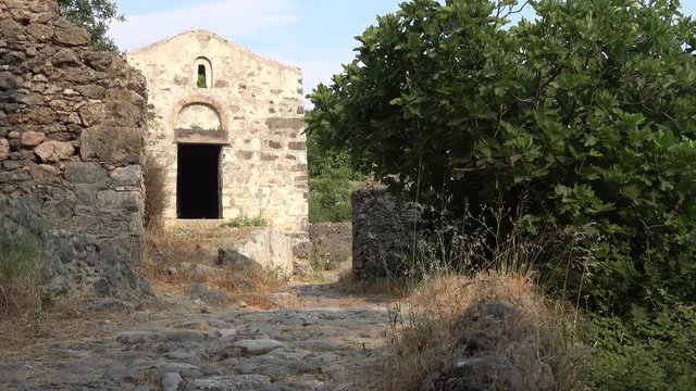 Kayakoy, Fethiye, Turkey - 12th of June 2019: 4K Entrance and front view of a small Orthodox church in Kayakoy
