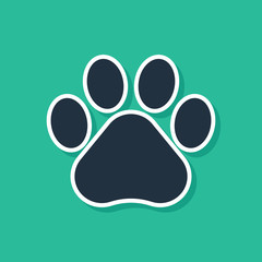 Blue Paw print icon isolated on green background. Dog or cat paw print. Animal track. Vector Illustration © Oksana