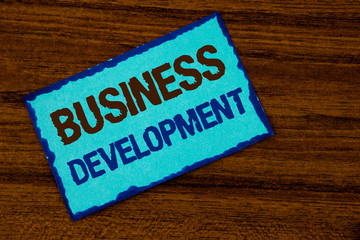 Text sign showing Business Development. Conceptual photo Develop and Implement Organization Growth Opportunities written Sticky note paper the Wooden background.