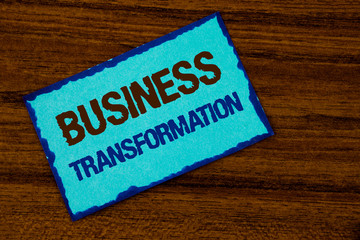 Text sign showing Business Transformation. Conceptual photo Making changes in conduction of the company Upgrade written Sticky note paper the Wooden background.