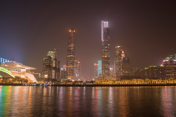 Plakat Zhujiang River and modern building of financial district at night in Guangzhou, China