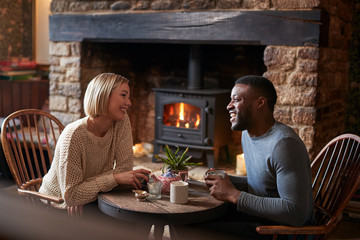 Couple Sitting At Table Drinking Tea In Traditional English Holiday Hotel