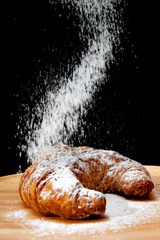 icing sugar falling  on Croissant