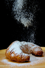 icing sugar falling  on Croissant