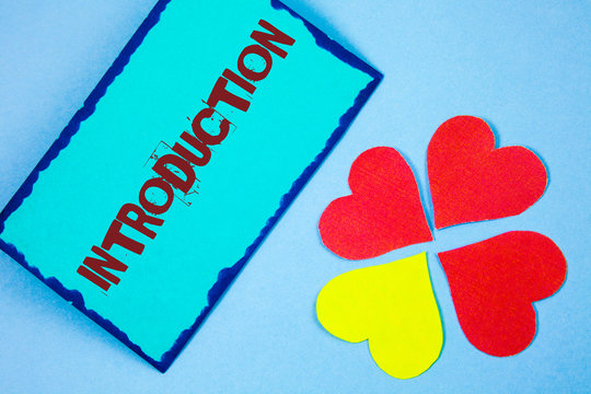 Text sign showing Introduction. Conceptual photo First part of a document Formal presentation to an audience written Sticky Note paper plain background Paper Love Hearts next to it.