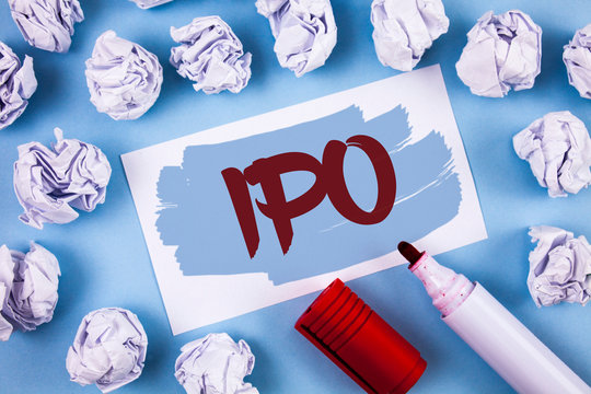 Handwriting text Ipo. Concept meaning Initial Public Offering First time stock of company is offered to public written Painted Sticky Note Paper within paper balls plain background Marker.