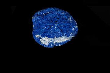 Macro mineral stone Azurite in siltstone against black background