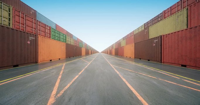 Endless rows of cargo shipping containers under blue sky. Camera moves slowly along stacked cargo containers painted in colors of different freight transportation business companies. Seamless loop.