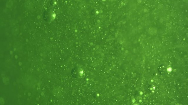 Green screen background of Particles, bokeh and bubbles moving up