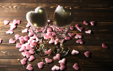 Hearts with wine glasses. Romantics love concept. Festive background. Valentines day postcard. Lights and lamps.