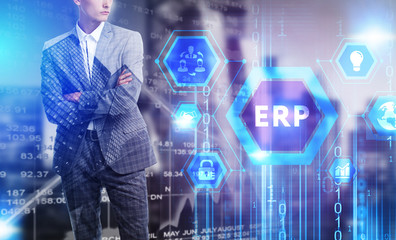 The concept of business, technology, the Internet and the network. A young entrepreneur working on a virtual screen of the future and sees the inscription: ERP