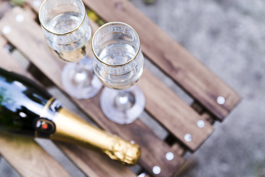 High Angle View Of Champagne Glass On Wooden Table