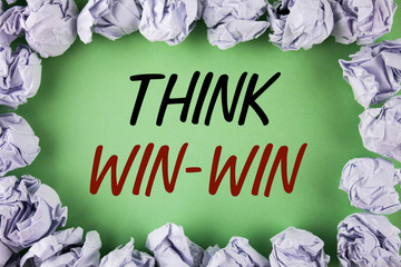 Handwriting text writing Think Win-Win. Concept meaning Negotiation strategy for both partners to obtain benefits written plain grean background within White Paper Balls.