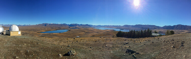Sweeping panoramic views of the spectacular golden Mackenzie Basin from the top of Mt John including Lake Tekapo