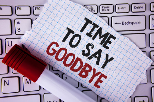 Conceptual hand writing showing Time To Say Goodbye. Business photo text Separation Moment Leaving Breakup Farewell Wishes Ending written Tear Notebook paper placed the Laptop Marker next to it..